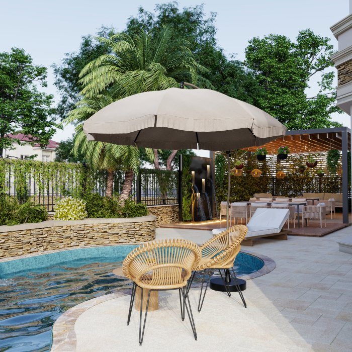 Free-form pool with a stone wall, an umbrella and rattan chairs — Heating Pool Water: Heat Pumps and Solar Collectors