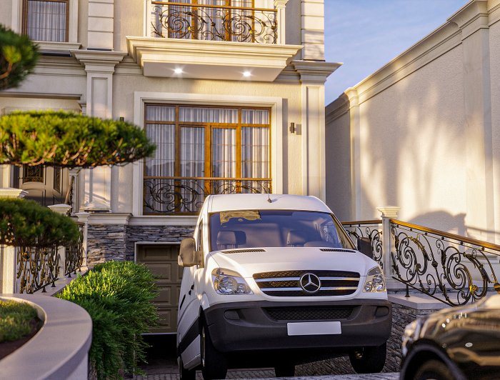 Narrow villa facade with wrought-iron balconies and a stone-clad plinth — Facade Cracks: Types and Repair Approaches